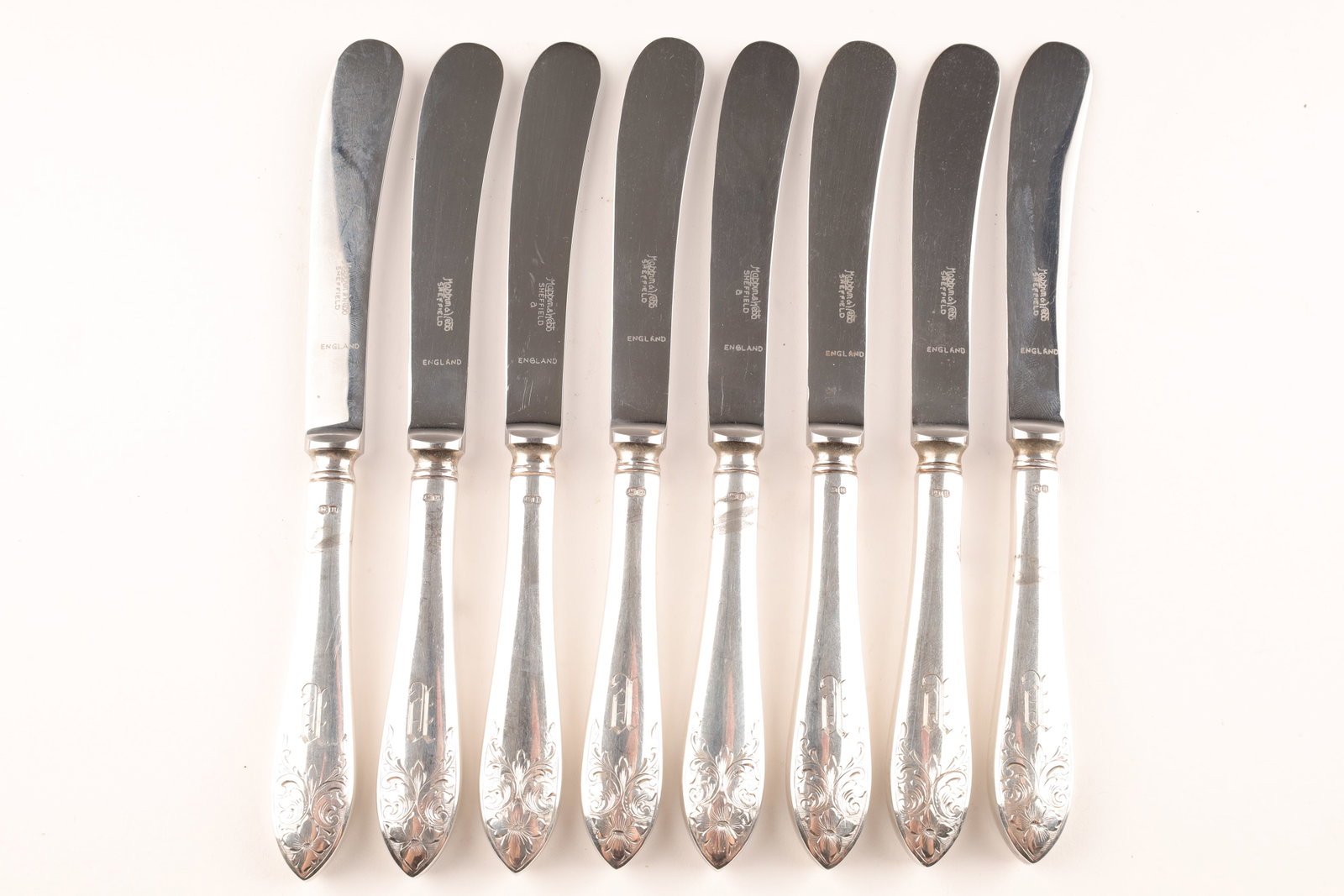 Set of 8 Mappin and Webb Sterling Butter Knives: Set of 8 Mappin and Webb Sterling Silver Butter Knives with Stainless blades. 277 grams total. Hallmarked and monogrammed handles. 7.25 inches L
