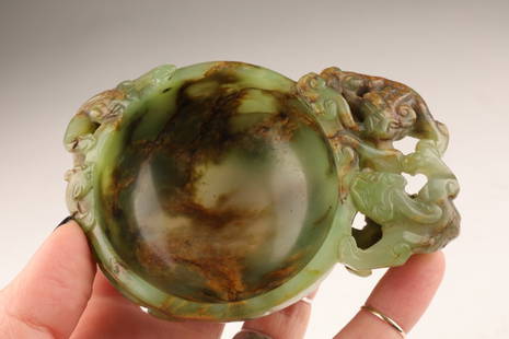 Signed Antique Chinese Carved Russet Jade Libation Cup Chilong Dragons: Signed Antique Chinese Carved Russet Jade Libation Cup Decorated with carved jade Chilong dragons on ornate wood Stand. Signed on outer rim of cup. 4 L x 3 W x 1.25 inches H, 2.75 inches H with stand.