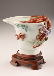 Antique Chinese Porcelain Dragon Libation Cup: Antique Chinese Porcelain Libation Cup with 9 applied molded dragons. Cup measures 3 x 4.5 x 3 inches W, with stand 4.5 inches H.