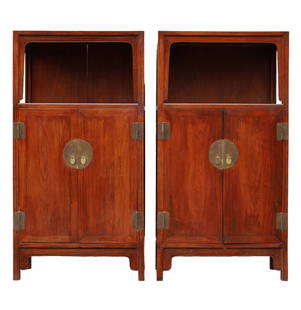 Pair of Antique Chinese Hardwood Display Cabinets: Pair of Antique Chinese Hardwood Display Cabinets with Brass Hardware. Each cabinet is comprised of a pair of hinged doors, a shelved interior with two drawers, all beneath a display shelf. 53 inches