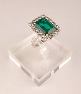 14K Gold, Diamond and Beryl Emerald Cocktail Ring: 14K Gold, Diamond and Beryl Emerald Cocktail Ring Size 7. Total weight, 8.04 grams. 18 round brilliant cut diamonds (two sizes) surrounding one large emerald cut beryl emerald set in four prongs in ro