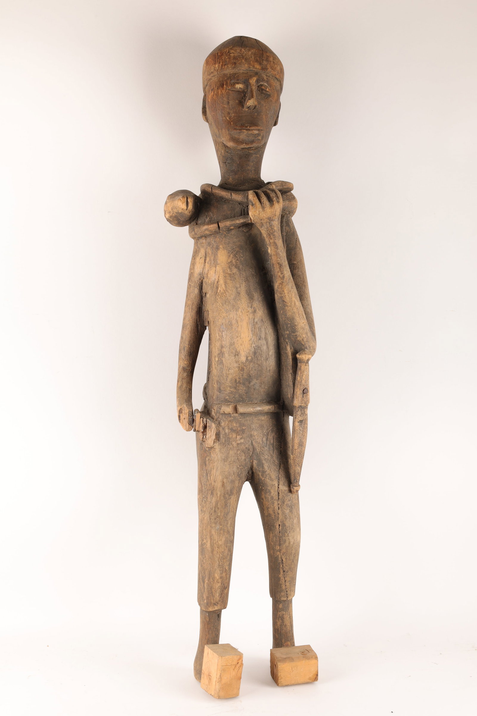 Carved African Hunter With Snake: Carved African Hunter With Snake. 36 inches H. Some loss, toes have broken off, been replaced.