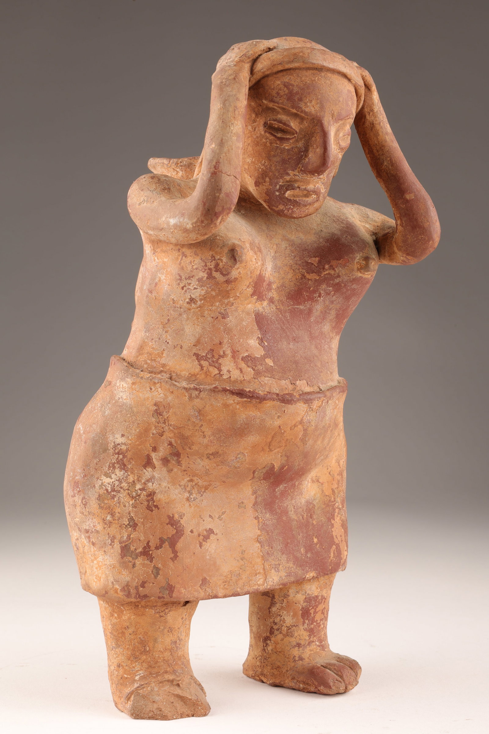 Antique Mexican Jalisco Terracotta Sculpture Woman: Antique Mexican Jalisco Terracotta Sculpture Woman with Jug on back. Measures 9.5 inches H x 5 W x 4 deep. Some loss to toes, please see photos.