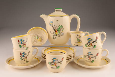 Vintage Rorstrand Disney Pinocchio Childs Tea Set: Vintage Rorstrand Disney Pinocchio Childs Tea Set. Five tea cups (one chipped) and saucers, one sugar bowl, one creamer (repair to handle), one teapot (chip to inner rim, hairline to handle). Teapot m