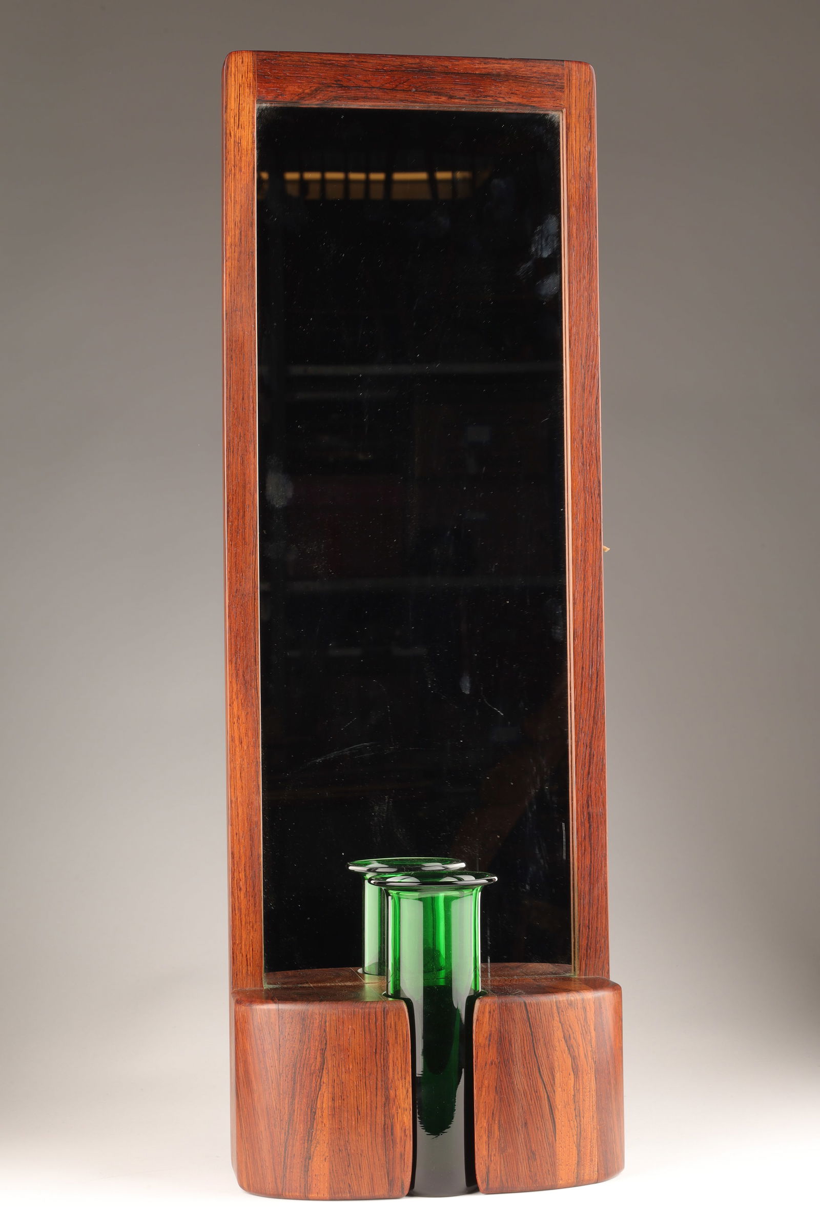 MCM Hermann Danish Rosewood Mirror Holmegaard Vase: Mid Century Modern Jacob Hermann Danish Rosewood Mirror for Randers Mobelfabrik and Holmegaard Vase. 23.5 inches H x 8 x3 deep, vase measures 6.25 inches H.
