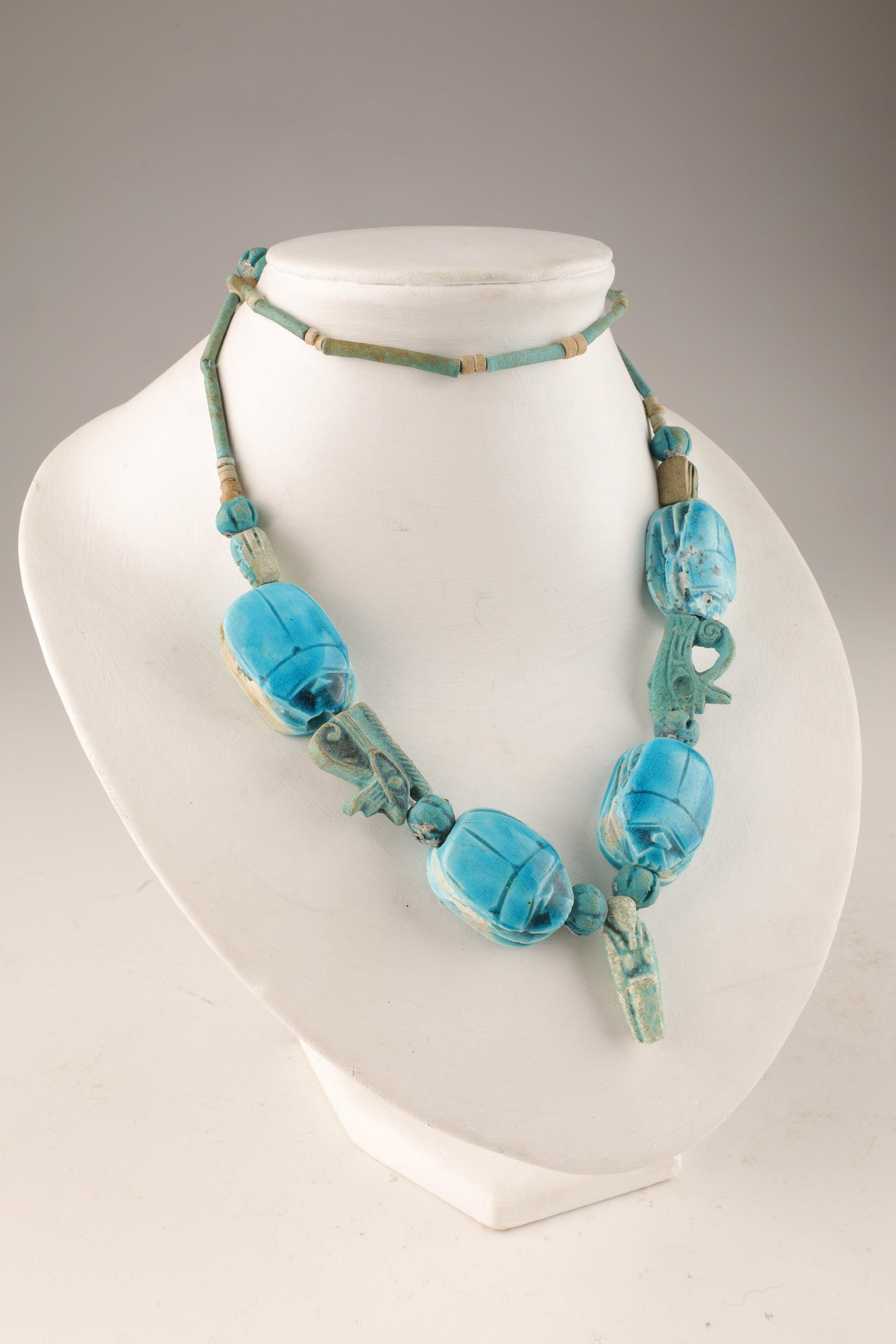 Vintage Egyptian Turquoise Faience Beads Necklace: Vintage Egyptian Turquoise Faience Beads Necklace. Comprised of scarab beetles, eyes and small Pharaoh pendant. 28 inches circumference. Purchased by the owner in Luxor, Egypt 1976