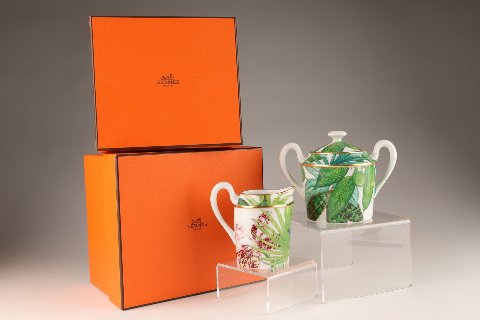 Hermes Porcelain Passifolia Sugar Bowl and Creamer: Hermes Porcelain Passifolia Sugar Bowl and Creamer, New in boxes. Made in France. Creamer measures 3.5 inches H x 3.75 W, box measures 6 x 6.5 x 4.24 inches H. Sugar bowl measures 4 inches H x 5.5 W,
