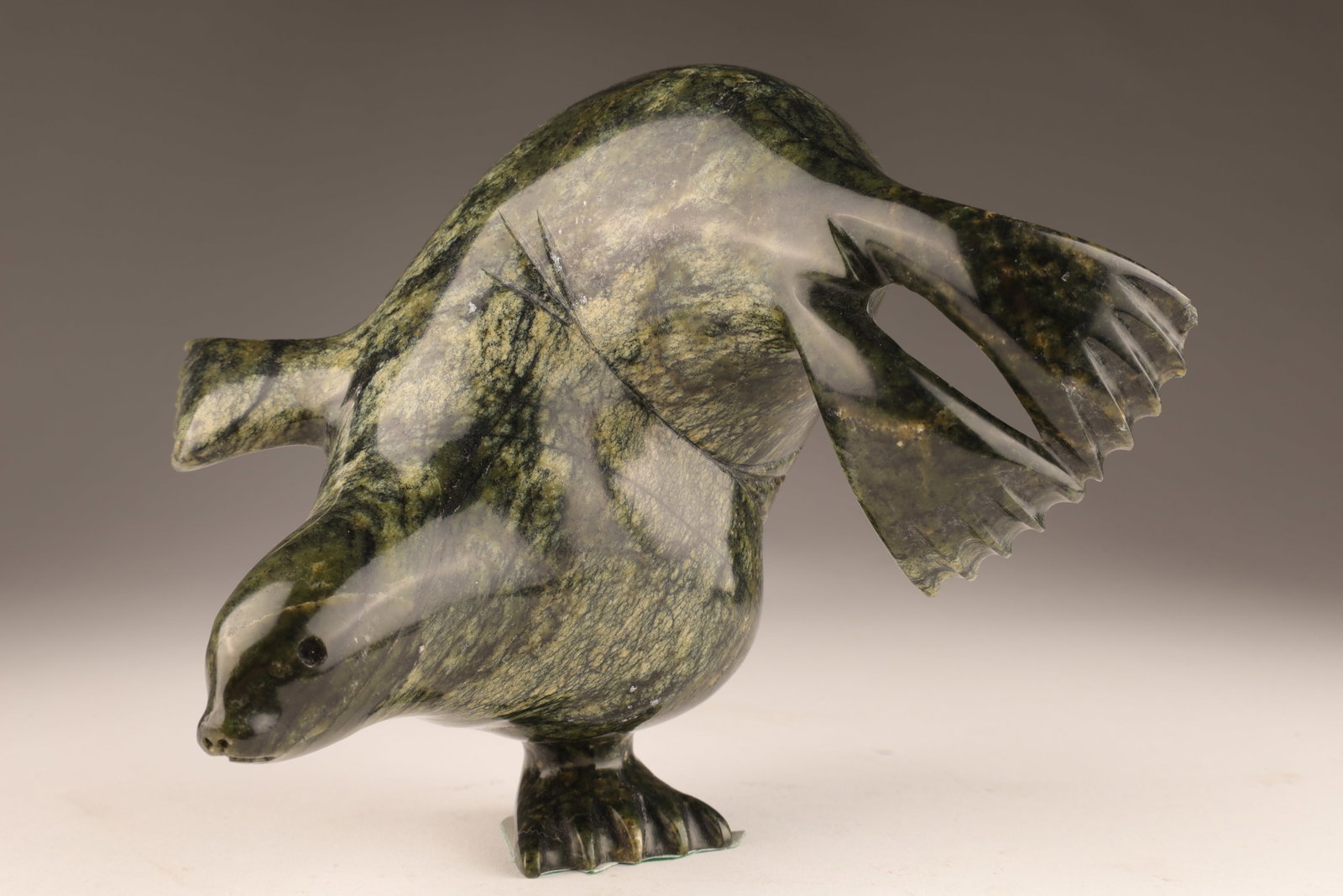 Cape Dorset Carved Diving Seal Ning Ashona: Inuit Cape Dorset Carved Diving Seal Ning Ashona. Signed on foot. 5 inches H x 5 x 6 W