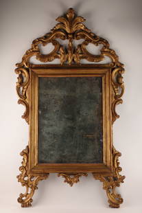 18th C Italian Venetian Ornate Gilt Carved Mirror: 18th C Italian Venetian Ornate Gilt Carved Mirror. Decorated with C scrolls and perfectly aged mercury glass mirror. Untouched back. 52 inches H x 29 W.