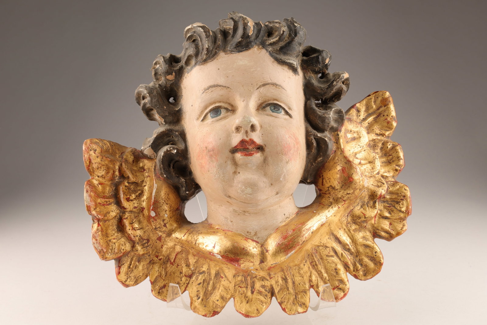 19th C Austrian Carved Polychrome Angel w/ Wings: 19th C Austrian Carved Wood Polychrome Angel Head with Wings. Some loss to surface. 9 inches W x 8 H x 4 deep.