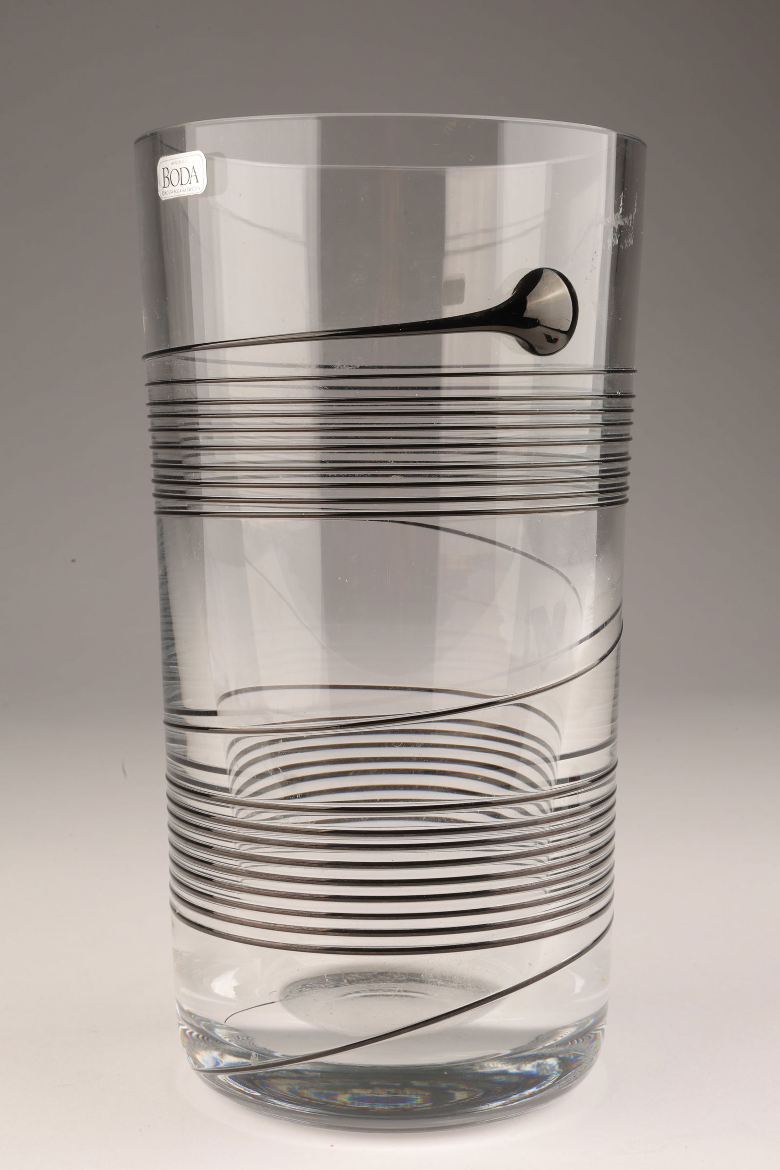 Signed Mod Bertil Vallien Kosta Boda SPIN Vase: Signed Modernist Art Glass Bertil Vallien Kosta Boda SPIN Vase. With original sticker. 7.25 inches H x 4 W.