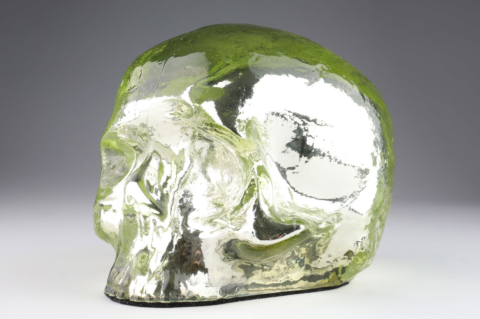 Ludvig Lofgren Gold Art Glass Skull for Kosta Boda: Ludvig Lofgren Gold Art Glass Skull for Kosta Boda. 6 x 7 x 6 inches W. Signed along base of skull.