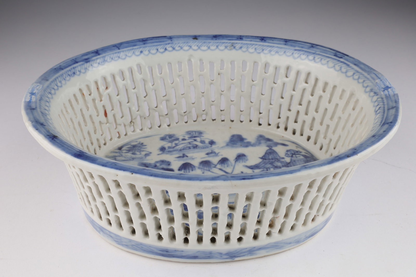 Antique Chinese Export Reticulated Basket: Antique Chinese Export Blue and White Porcelain Reticulated Basket. 7.5 x 8.5 x 3 inches H. Some restoration to edges, please see photos.