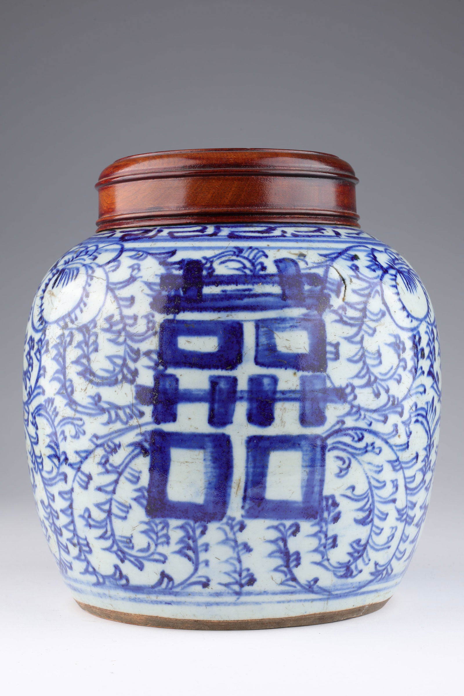 Antique Chinese Blue and White Ginger Jar: Antique Chinese Blue and White Double Happiness Ginger Jar with wood cover. 8 inches H x 6.5 W. Some surface abrasions, please see photos.