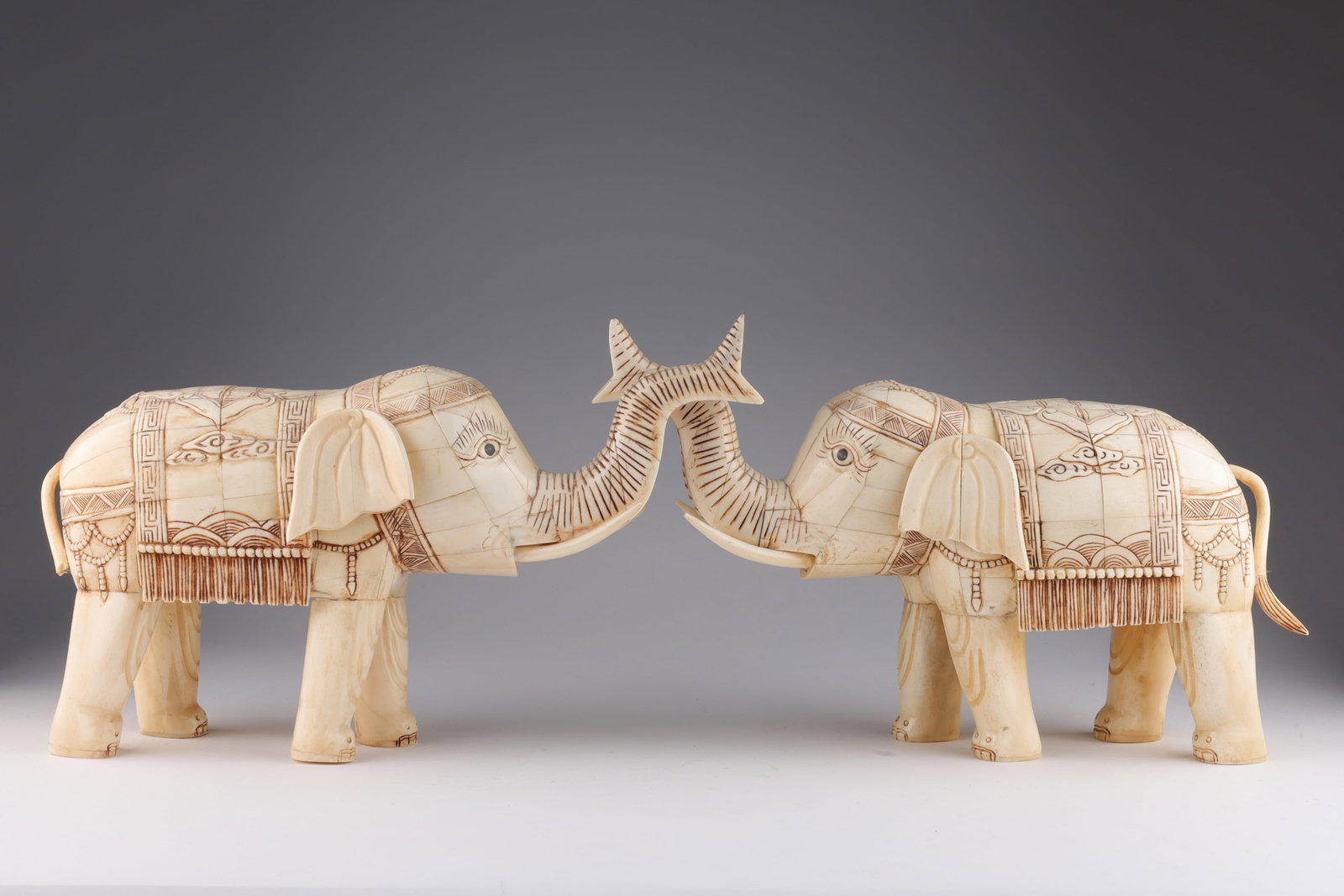 Pair Chinese Hand Carved Bone Elephants: Pair Chinese Hand Carved Decorated Bone Elephants Sculptures. 14 inches L x 8 H. Some loss, breaks.
