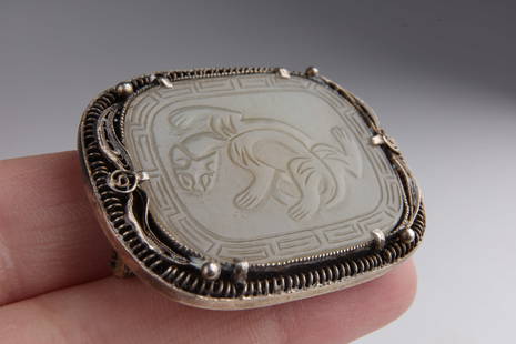 Antique Chinese Carved Jade Silver Brooch: Antique Chinese Carved Jade Medallion and Silver Filigree Brooch. 1.5 inches L x 1.25 H. Marked on back.