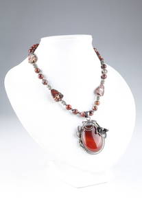 Art Nouveau Silver and Carnelian Pendant Necklace: Art Nouveau Silver and Carnelian Pendant Necklace. SSP 925 hang tag, pendant marked 925. Necklace measures 19.5 inches L, pendant measures 2.5 L.