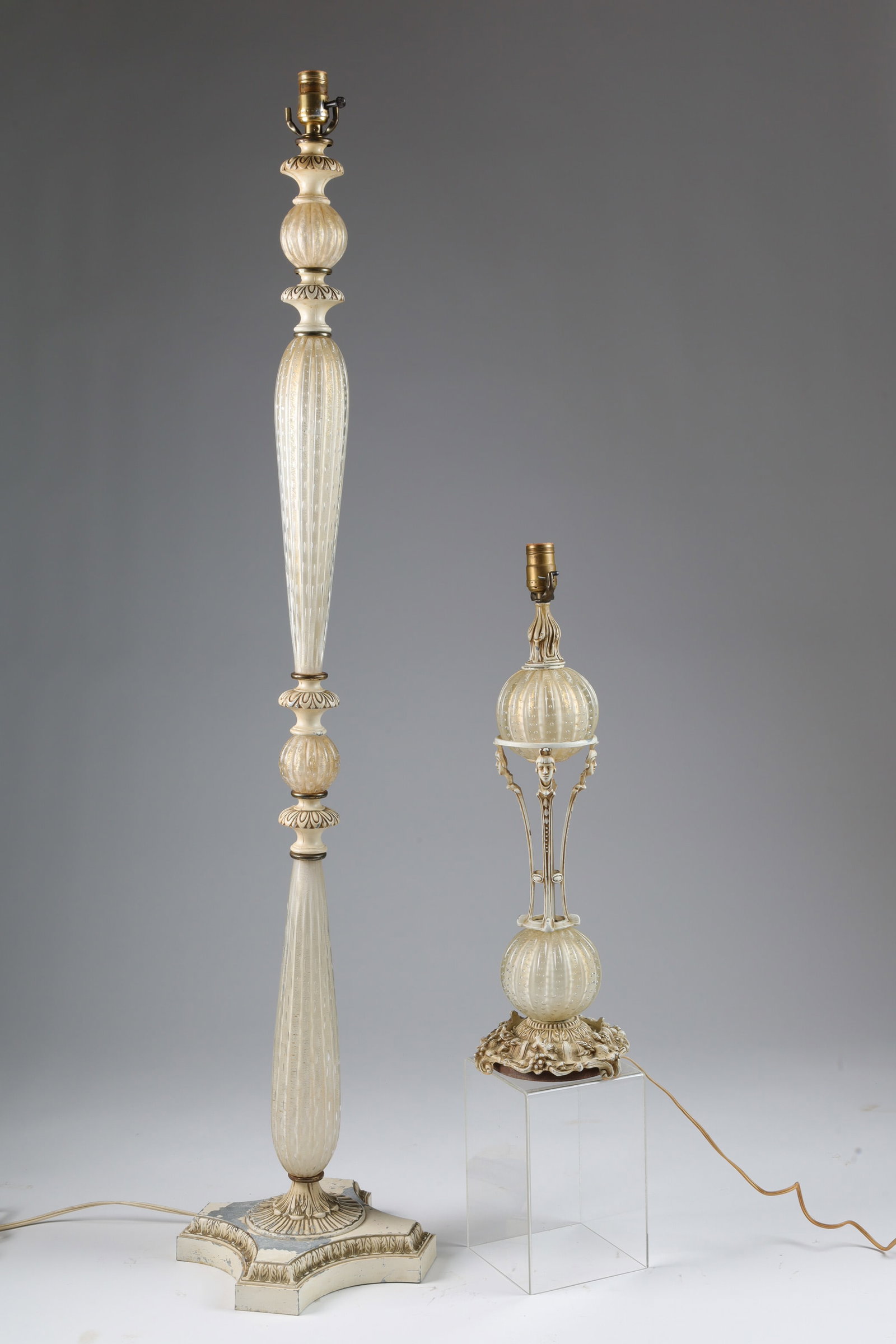 Lot Murano Barovier Toso Gold Fleck Art Glass Lamps: Lot of 2 Murano Barovier and Toso Hollywood Regency Controlled Bubble Gold Fleck Art Glass Lamps. Floor lamp measures 53 inches H, table lamp decorated with faces measures 23.5 inches H.