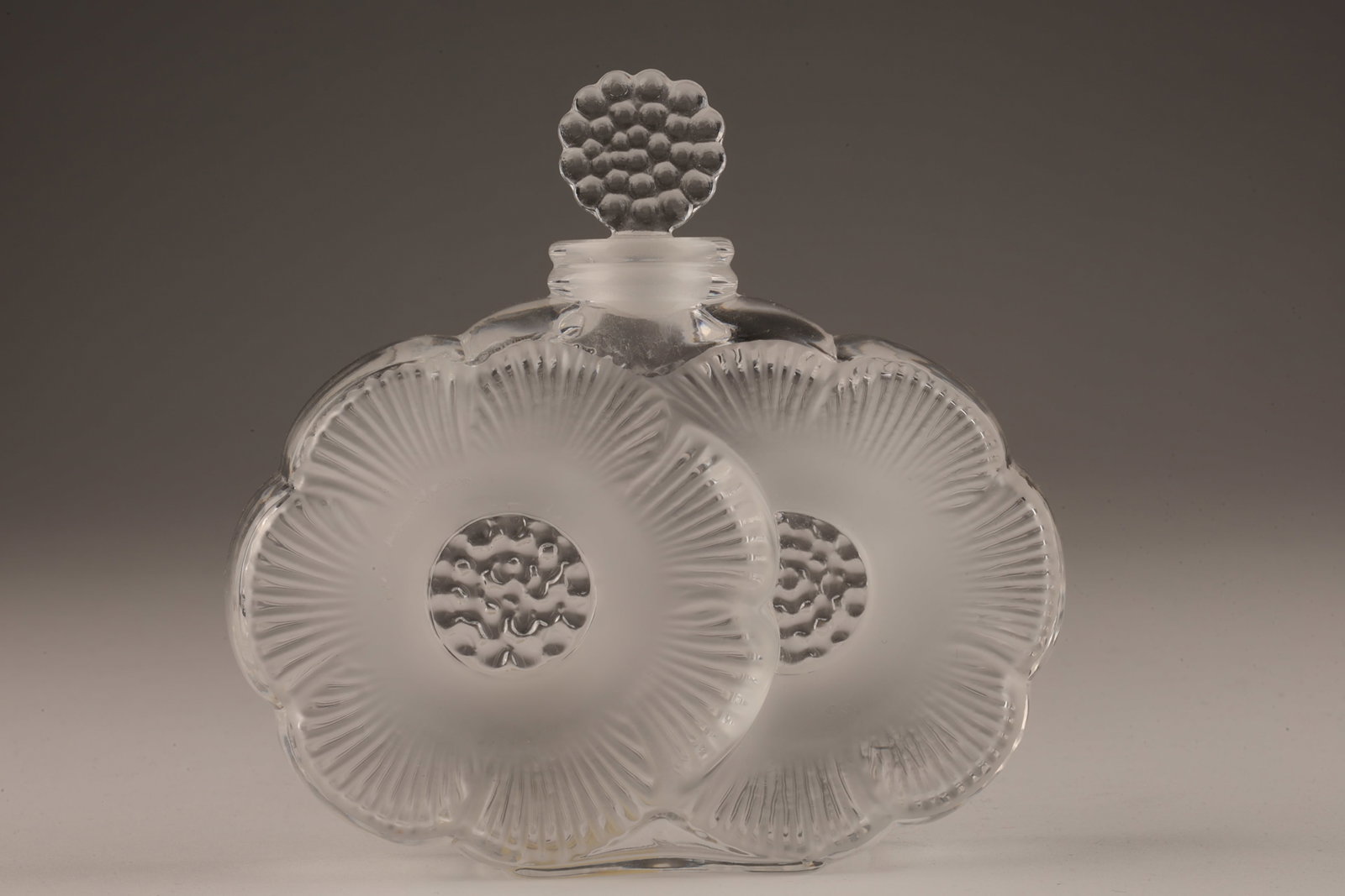 Signed Lalique France Deux Fleurs Perfume Bottle: Signed Lalique France Deux Fleurs / Two Flowers Perfume Bottle. 3.5 x 3.5 x 1 inch deep.