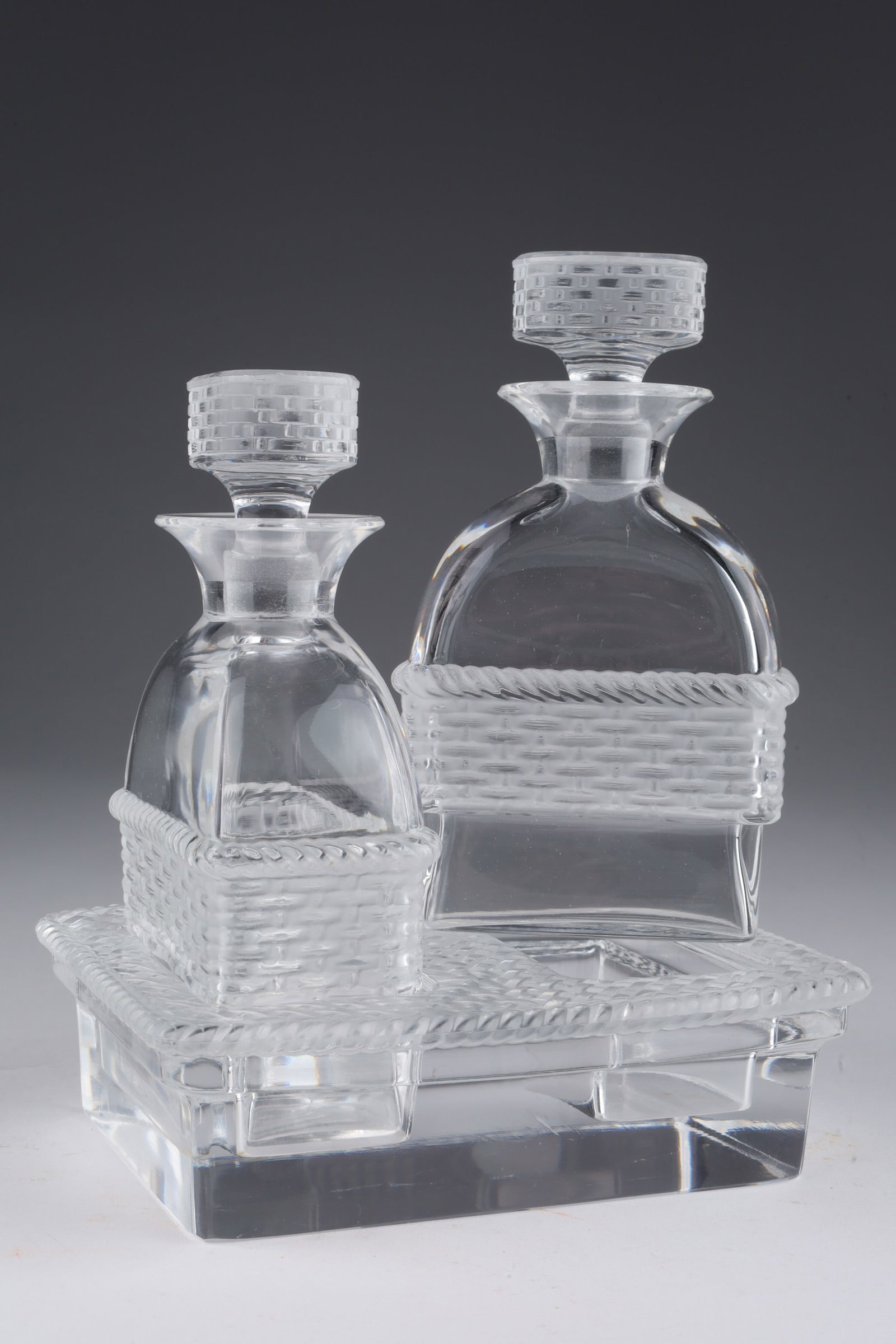 Lalique Bangkok Crystal Vinegar Oil Cruet Set: Cristallerie Lalique France crystal vinegar and oil two bottle cruet set but can also be used for other sauces and dressings, the bottles fit into a heavy base base, all piece with a basket weave styl