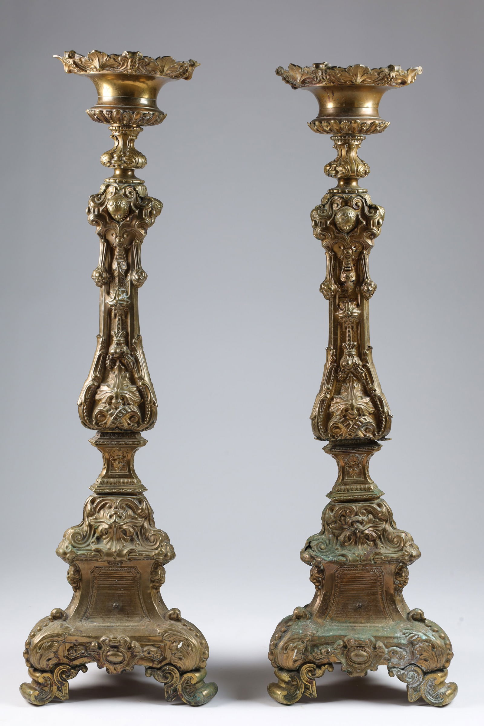 Pair Large Antique Bronze Ornate Altar Prickets: Pair Large Antique Bronze Ornate Church Altar Prickets Candlestick Stands. 43 inches H. Decorated with masks and dolphins, on tripod base.