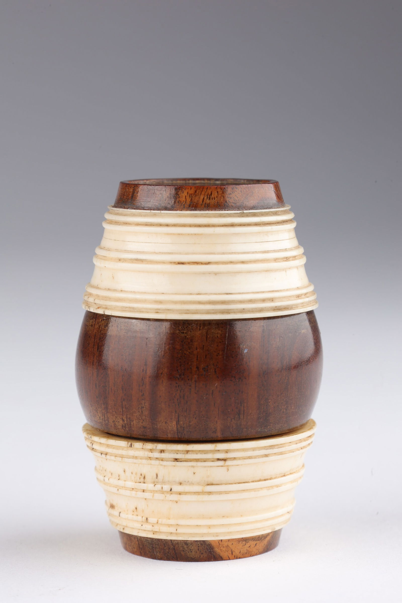 Georgian Bone / Treen Barrel Shaped Nutmeg Grater: Unique Georgian Regency barrel shaped nutmeg grater, the three part body of turned fruitwood and bone with reeded design, inset with metal grater at one end, has very old nutmeg inside. 2 inches H.