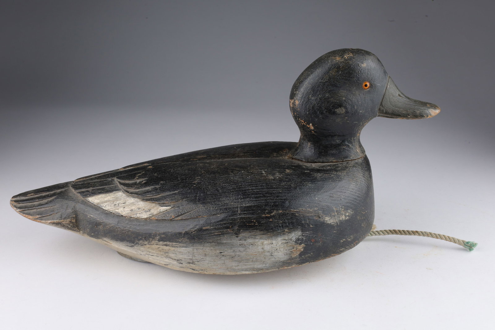 Carved Wood Duck Decoy Golden Eye Hen: Carved Wood Duck Decoy Golden Eye Hen. With lead weight and large red L on bottom. 13 inches L x 6 W x 6 H.