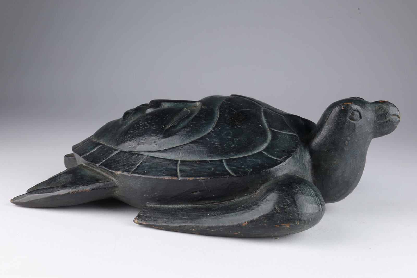West Coast Carving Turtle with Face on Shell: West Coast Carving Turtle with Face on Shell. 12 inches L x 8 W x 4 H.