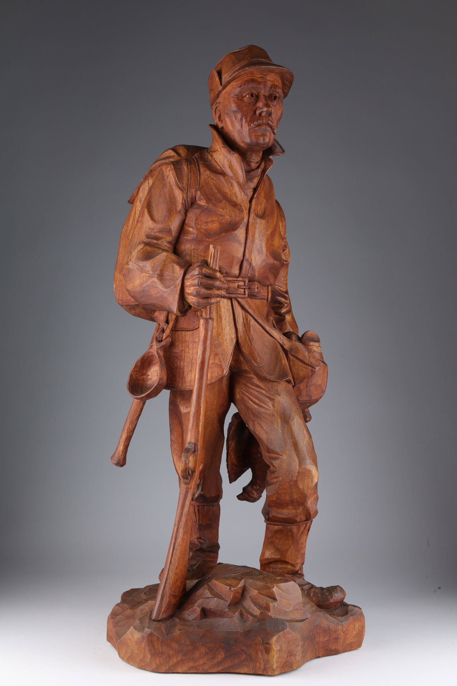 Quebec Folk Art Butternut Hunter Roger Bourgault: St Jean Port Joli Quebec Folk Art Carved Butternut Hunter Signed Roger Bourgault (Canadian, 1938-2008). 30 inches H x 12 W.