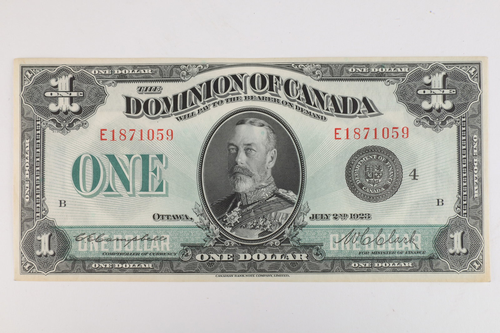 Dominion of Canada 1923 1 Dollar Bill Uncirculated: Dominion of Canada 1923 issue about uncirculated dollar bill bank note, serial number E1871059, Campbell Clark, black seal, group 4. 3.25 inches H x 7 W.