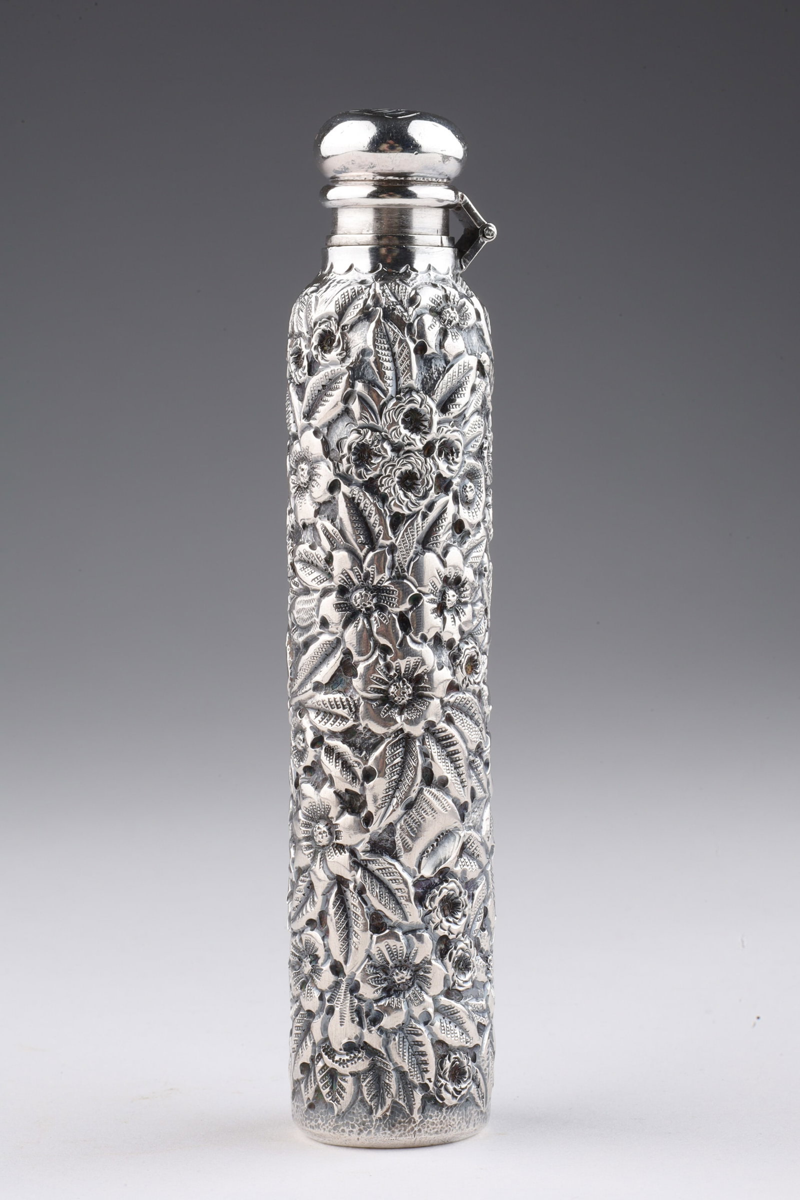 Black Starr / Frost Sterling Repousse Scent Bottle: American early 19th century solid sterling silver repousse scent bottle with all over floral and foliage design, with stunning patina that highlights the design, with screw flip top lid, marked on bas