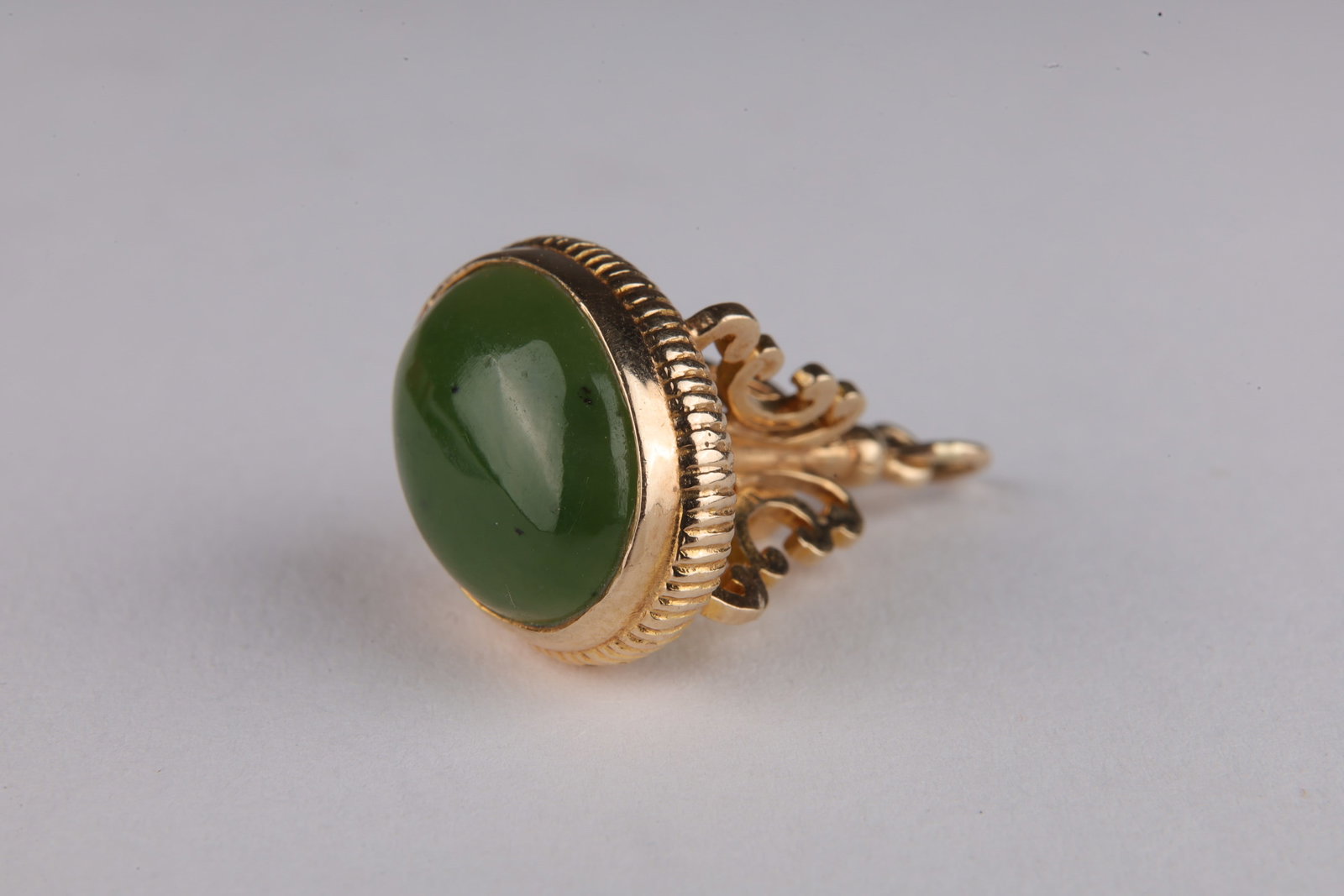 10K Gold and Jade Watch Fob Pendant: 10K Gold and Jade Watch Fob Pendant. 3.2 grams total weight. Acid tested. 1 inch L including ring.