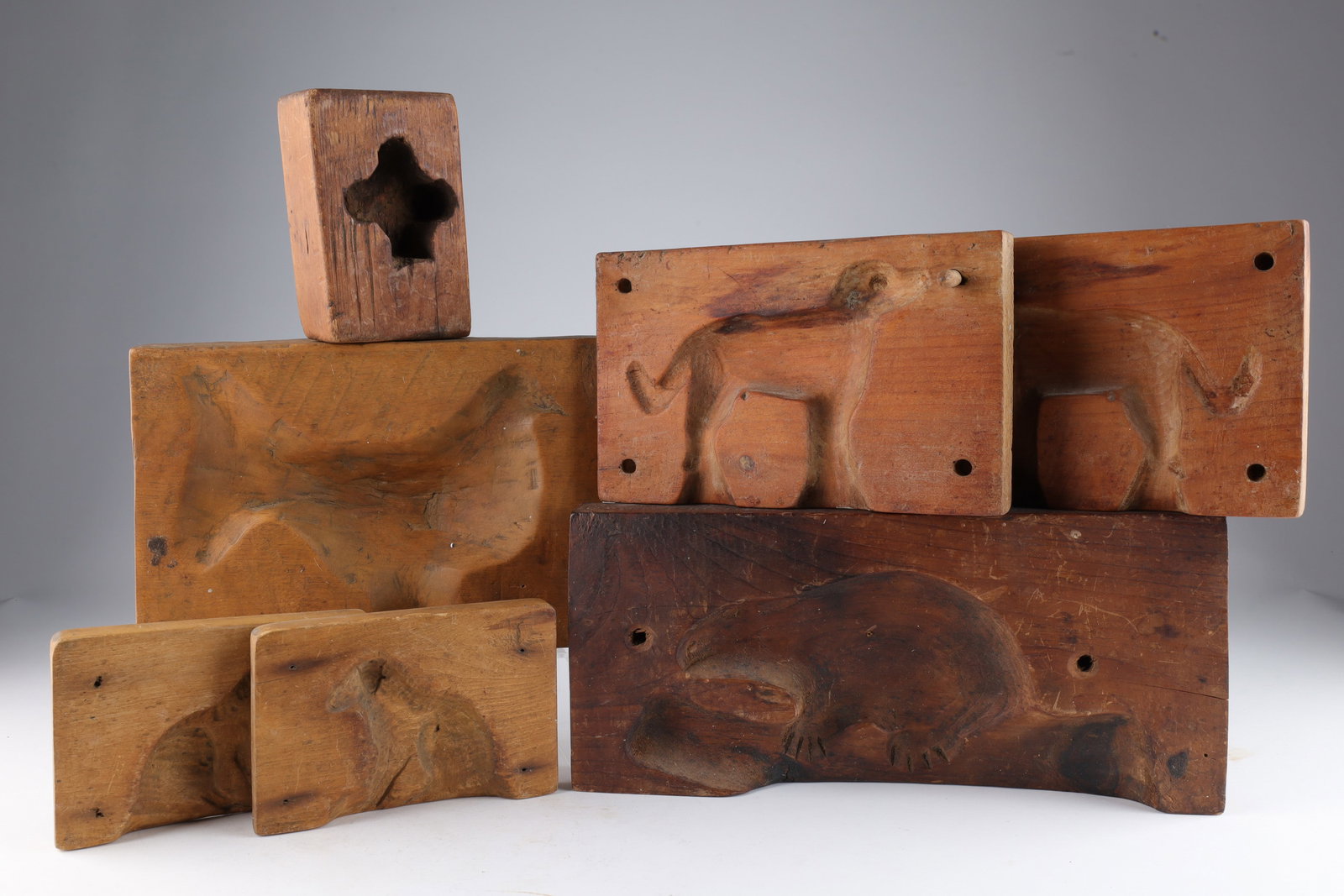 Collection of Antique Quebec Sugar / Butter Molds: Collection of Antique Quebec Sugar / Butter Molds. Two two part molds of dogs, one very large beaver mold (6 inches H x 12.5), one chicken mold (6.5 x 9.5 inches) and one small signed mold (Louis Geor