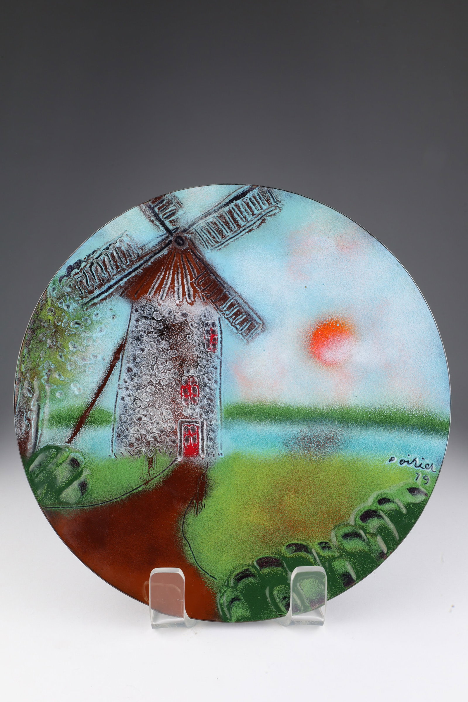 1979 Bernard Seguin Poirier Enamel on Copper Plate: 1979 Bernard Seguin Poirier Enamel on Copper Plate, Landscape with Wind Mill by lake. Inscribed on verso, Ville de la Pointe du Moulin. 11.75 inches diameter.