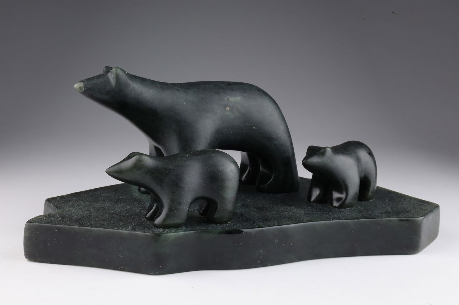Inuit Soapstone Carving Ross Parkinson Bears: Inuit Steatite Soapstone Carving singed Ross Parkinson Canada, Mother Bear and 2 Cubs on Stone. 10 inches W x 6 deep x 4 H.