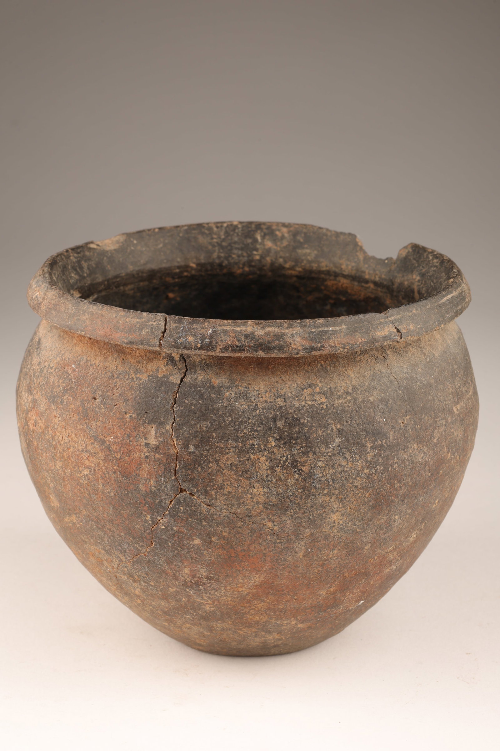 Antique Terracotta Pot: Antique Terracotta Pot. With darkened surface. Chips to rim, crack to body. 5 inches diameter x 4.5 H.