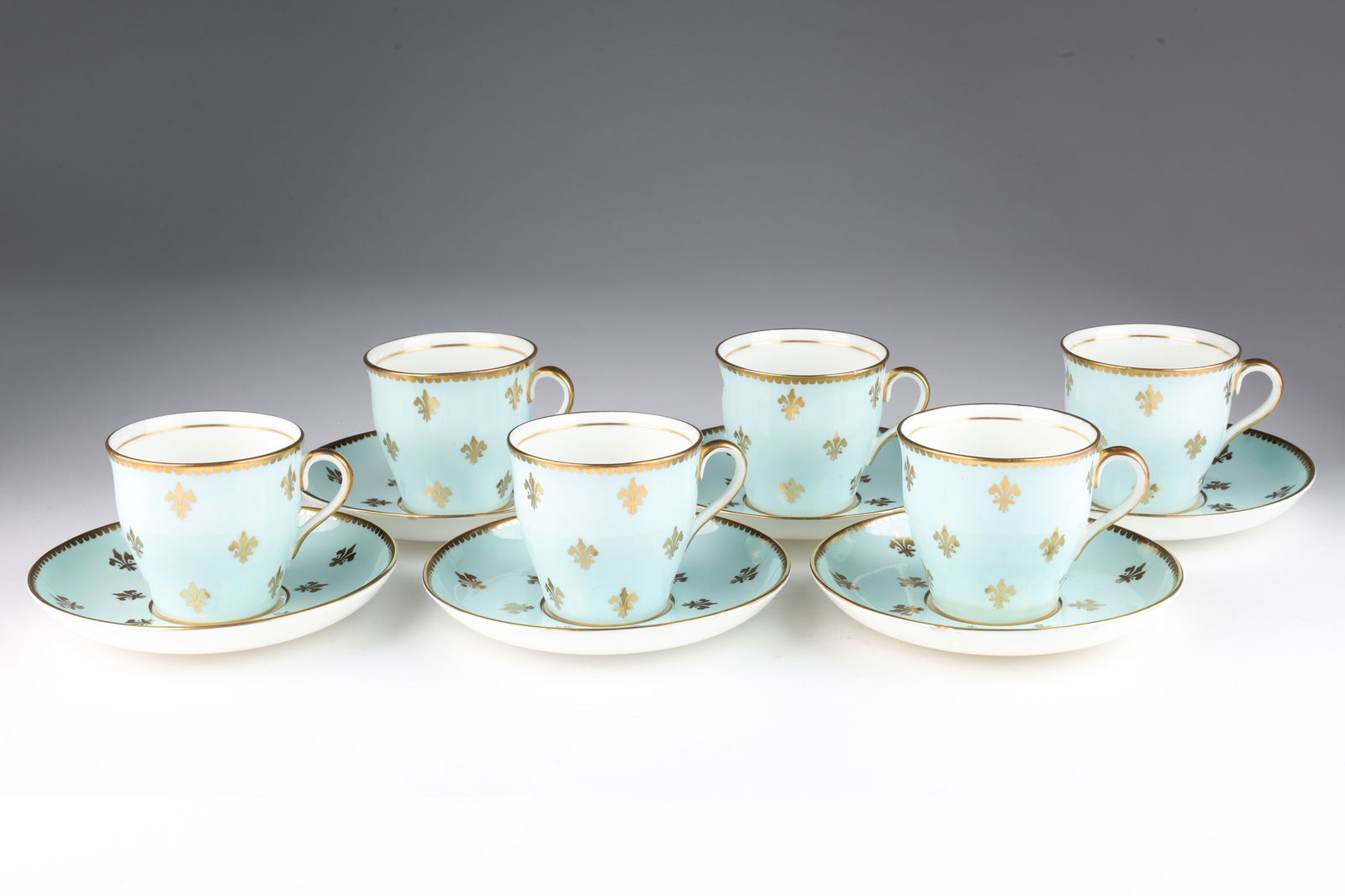 Aynsley Gold Fleur de Lys Blue Demitasse Cups: Set of 6 English white bone china demitasse cups and saucers by John Aynsley and Sons of Staffordshire, England, the cup and saucer with a gold fleur de lys motif on a powder blue ground, circa 1950s,