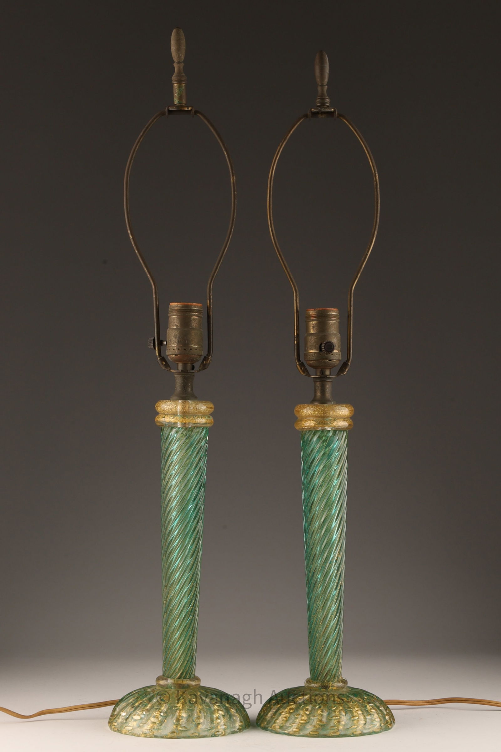 MCM Murano Green Gold Dust Lamps Barovier Toso: Mid Century Murano Green Art Glass Gold Dust Table Lamps attributed to Barovier and Toso. Measure 25 inches H with harps x 5 W at bases.