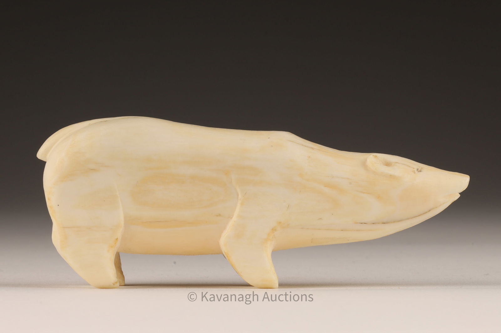 Inuit Carved Whale Tooth Figure Polar Bear: Inuit Carved Whale Tooth Figure of a Standing Polar Bear. Purchased in 1955 from a Husdon Bay Post in Happy Valley-Goose Bay, Labrador. 3.5 inches L x 1.5 H x 1 W. This item cannot be exported from Ca