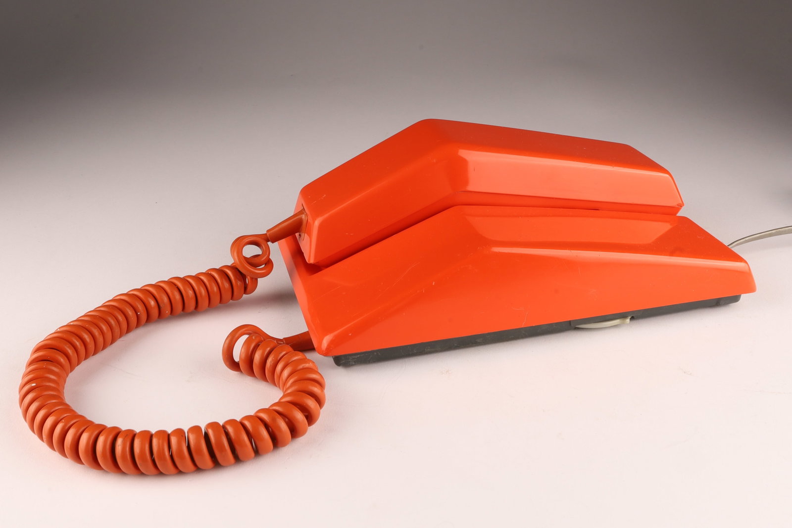 1970s Northern Electric Orange Contempra Phone: 1970s Northern Electric Orange Contempra Dial Phone. 9 inches L x 5 W x 3 H.