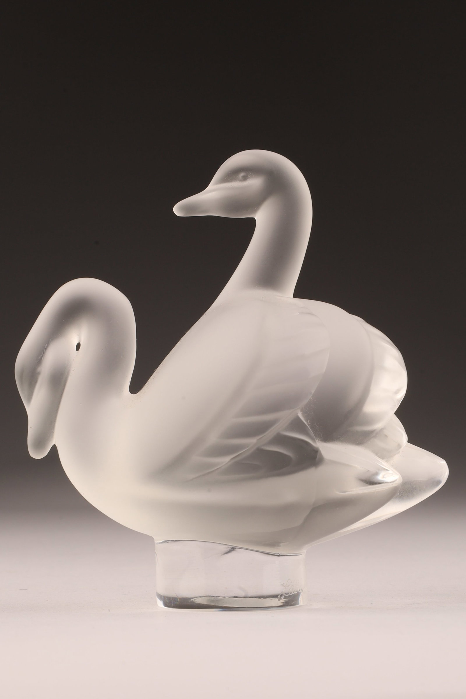Signed Lalique Frosted Crystal Entwined Swans: Signed Lalique France Frosted Crystal Entwined Swans. 3.25 inches H x 3 W.