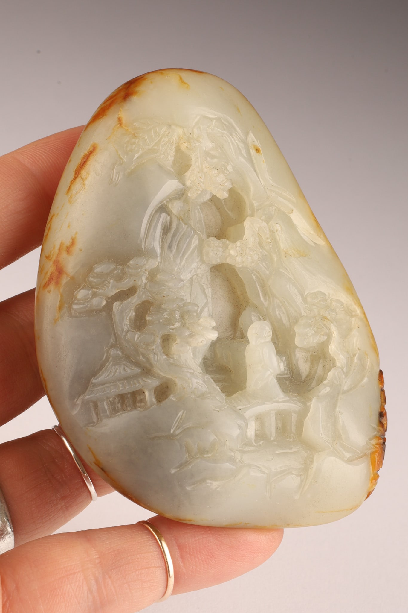 Chinese Russet Jade Mountain with Figure: Chinese Russet Jade Mountain with Recessed Carved Figure. 3.5 inches H x 2.5 W.