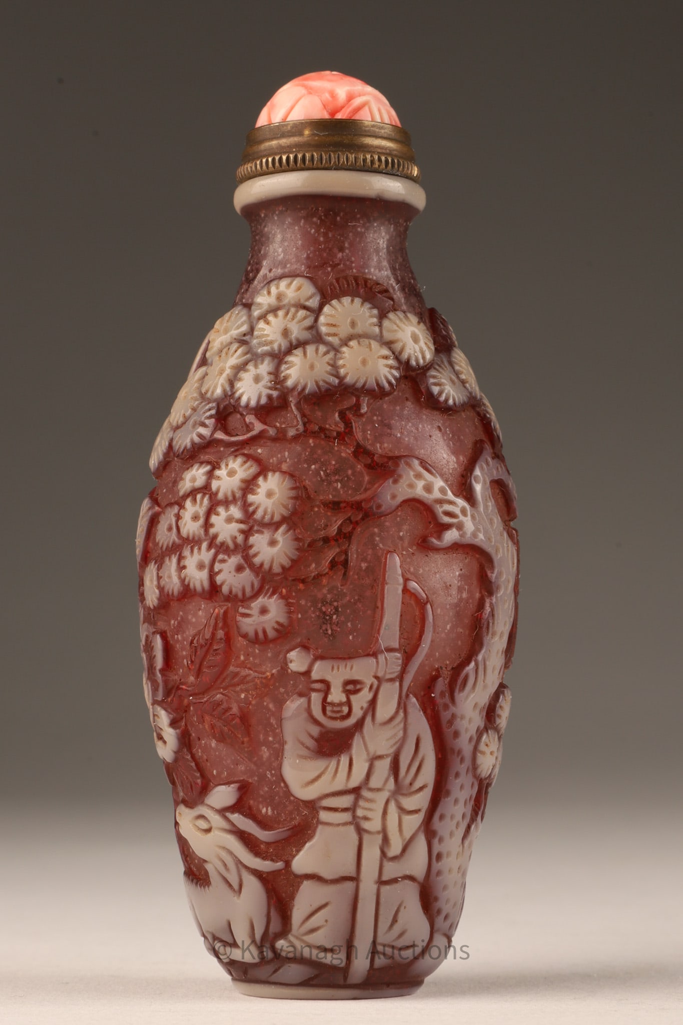 Chinese Cut to Amethyst Glass Snuff Bottle: Chinese Figural White Cut to Amethyst Glass Snuff Bottle. Decorated with a shepherd with goats in a forest, signed. Metal spoon with carved pink coral top. 3. 5 inches H.