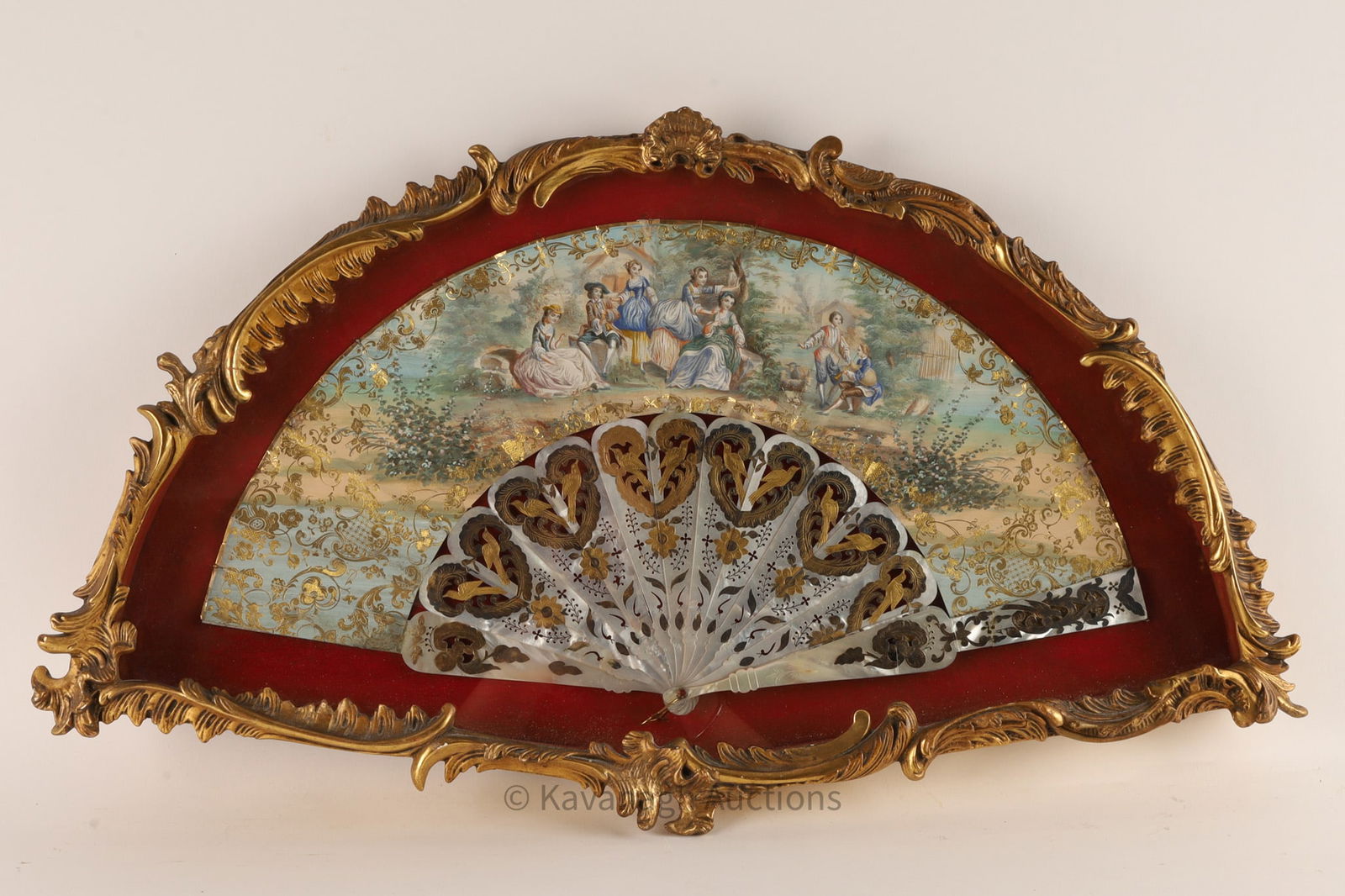 French Empire Painted Fan Court Ladies Framed: French Empire period fan set in acanthus scroll bordered case (frame), the leaf of the fan with hand painted romantic scene of court ladies and suitors, the carved and cut mother-of-pearl handle with