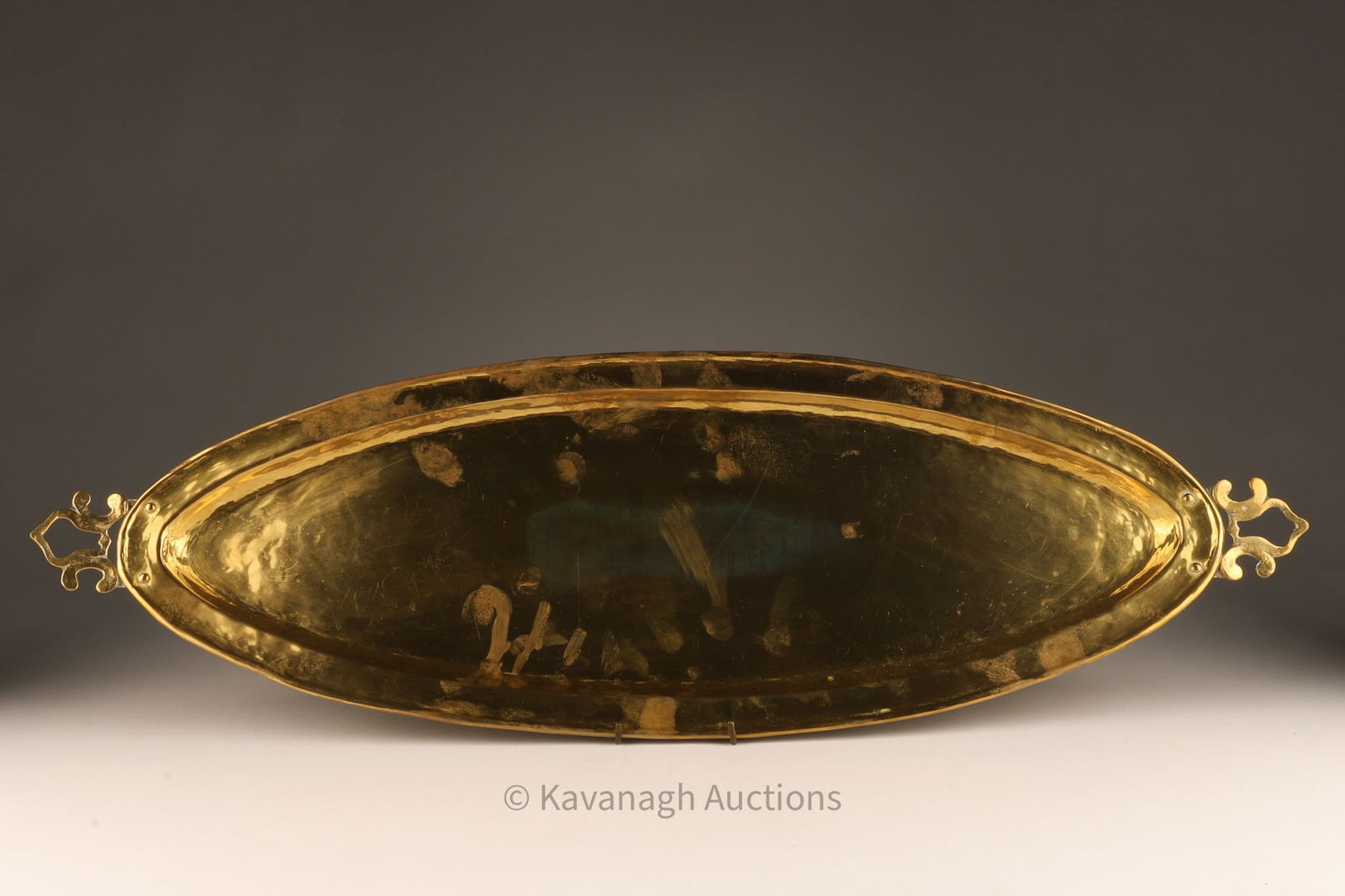 Paul Beau Arts Crafts Hand Hammered Oval Tray: Paul Beau (Canada, 1871 – 1949) unique Canadian Arts and Crafts hand crafted and hammered large oval tray with rolled edge and attached decorative handles, stamped on reverse Paul Beau and Co. Montr