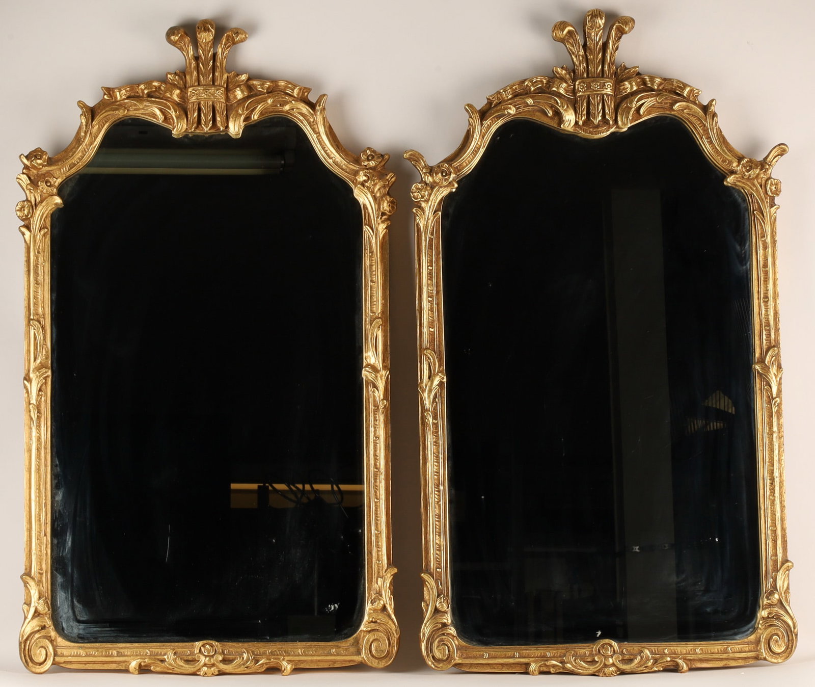 Pair Gilt Friedman Bros Hollywood Regency Mirrors: Near or Matched Pair of Gilt American Friedman Brothers Decorative Arts of N.Y.C. Gilt Neoclassical or Hollywood Regency Mirrors with Feathered Fleur de Lis. 36 inches H x 21 W.