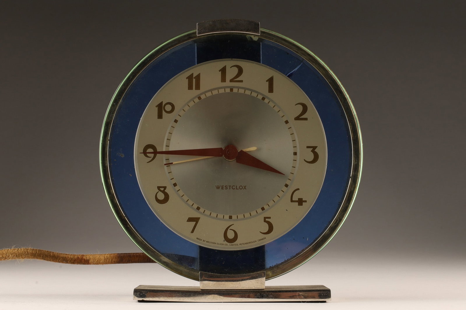 Art Deco Westclox Andover S2-L Electric Clock: Art Deco Electric Westclox Andover S2-L Electric Cobalt Blue Clock C. 1940s. One break to blue glass. 6 inches H x 6 W x 1.75 deep. Functioning.