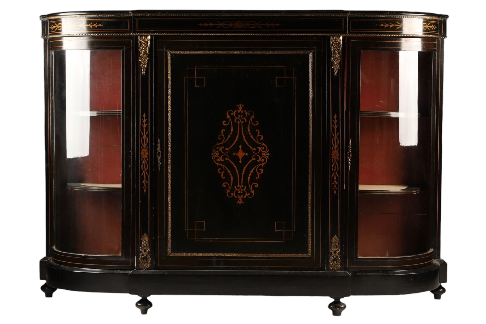 19th C English Victorian Ebonized Inlaid Credenza: 19th C English Victorian Ebonized Inlaid Credenza. With bowed glass doors, brass mounts and inlaid decoration on centre door and frame on turned feet. Measuring 59 inches L x 42 H x 15 deep.