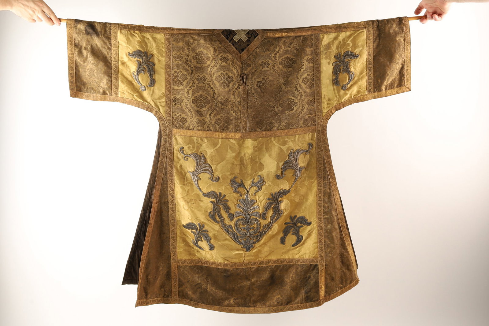 Antique 17th-18th C Liturgical Dalmatic Tunic: Antique 17th-18th C Liturgical Dalmatic Tunic. Decorated with embroidery and applied needlework patches. Some staining, repairs as shown. 34 inches W x 36 inches L on either side of the body.