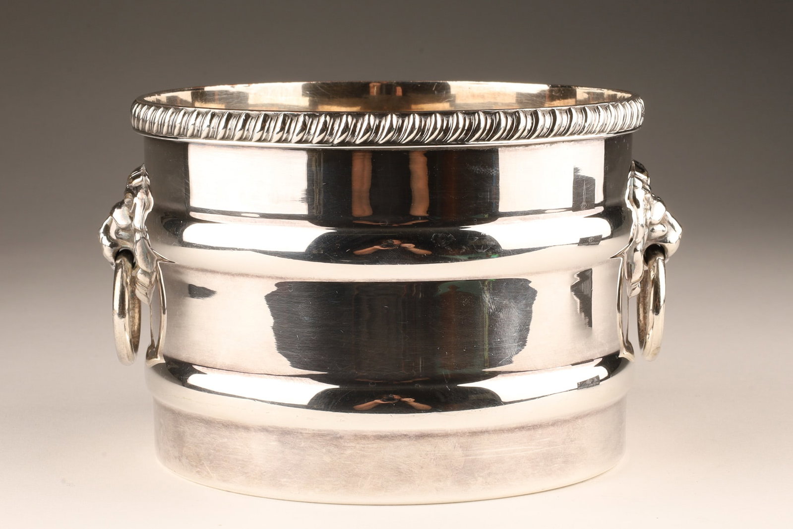 Sheffield Silvered Champagne Ice Bucket Lion Masks: Sheffield Silver Plate Champagne Ice Bucket with Lion Mask ring handles. 6 inches W x 4 H.